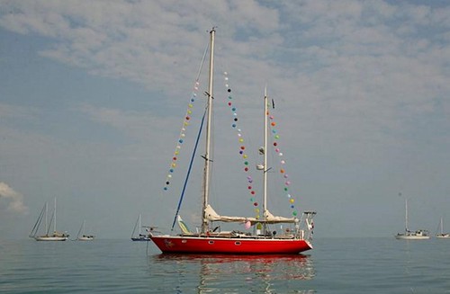 Laura Dekker’s boat Guppy ’dressed ship’ in Fanny Bay in Darwin - time to celebrate a birthday! ©  SW